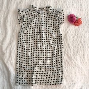 Black and white patterned blouse